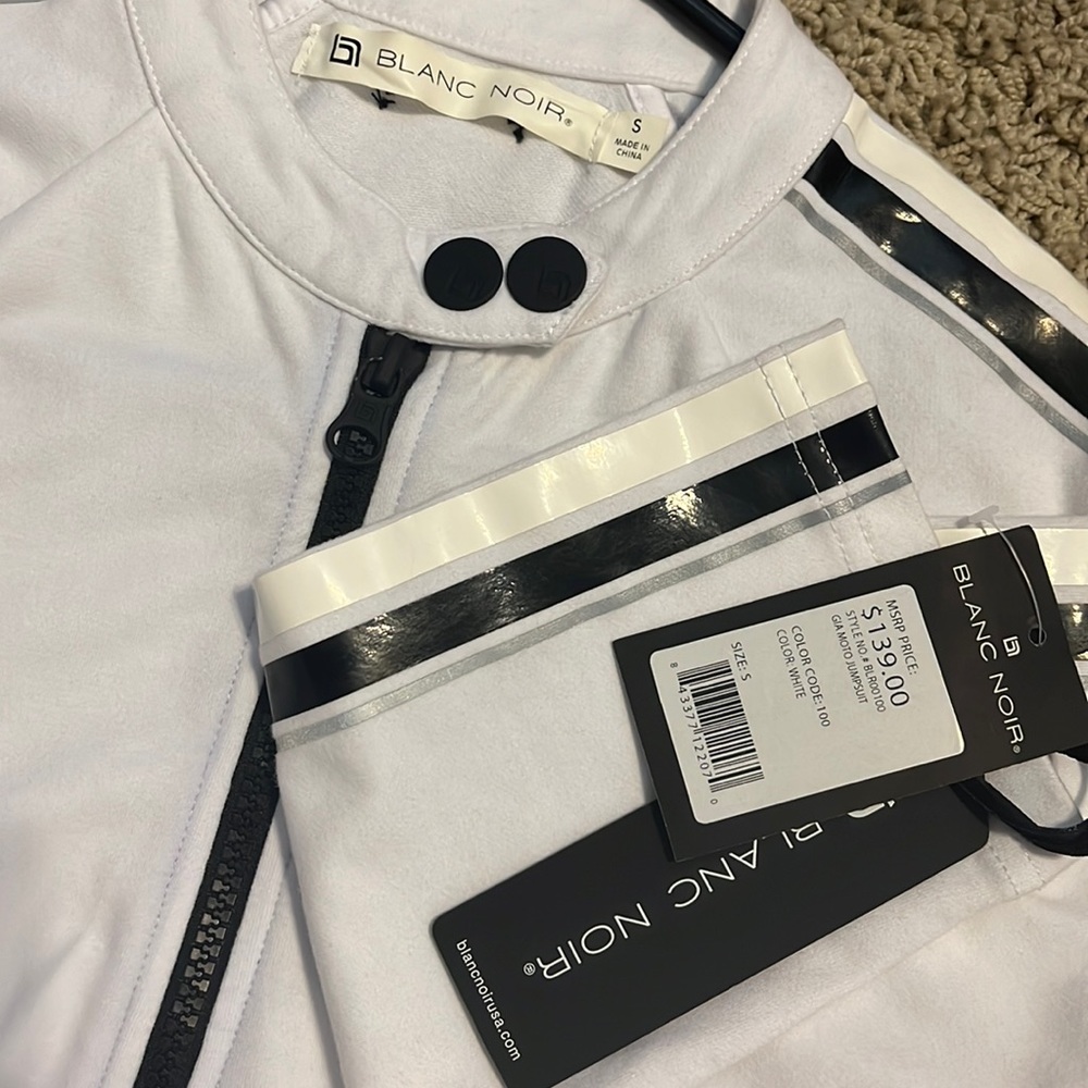 Blanc noir white romper with black detail, size small.